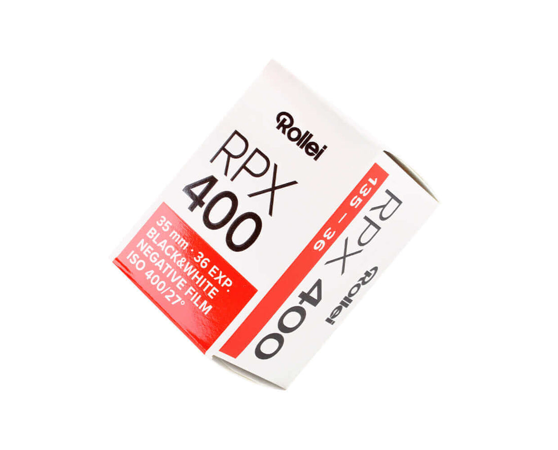 White and red cardboard box of rollei rpx 400 black-and-white negative film.