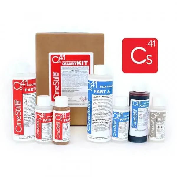 Cinestill c41 quark kit, a professional film development kit featuring multiple labeled bottles with red and blue labels for different parts of the chemical process.