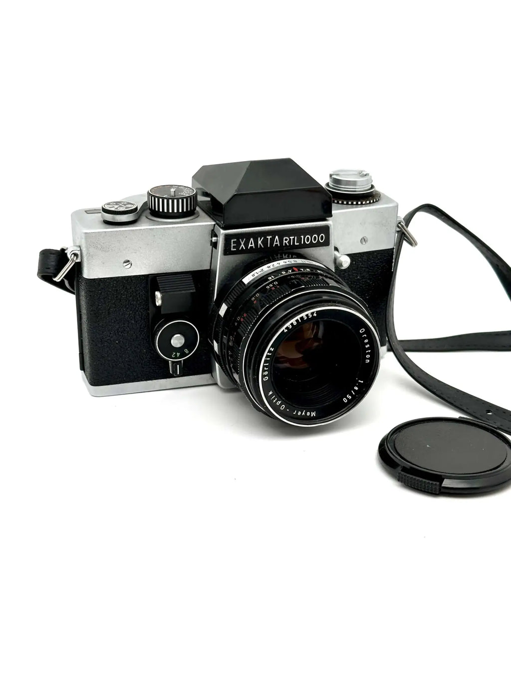 Silver and black exakta rtl 1000 film camera with a mounted lens.