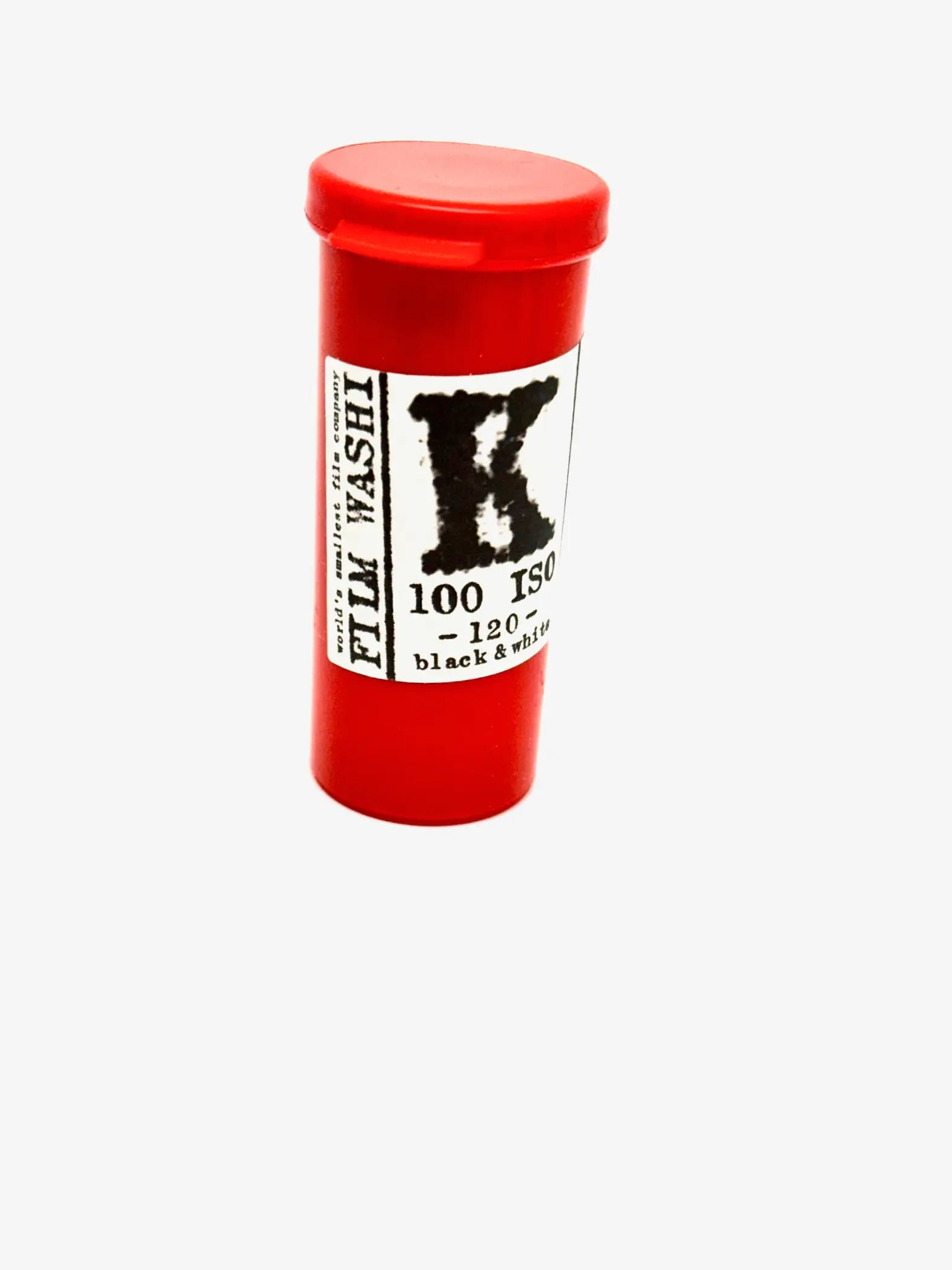 Red cylindrical container of film washi 100 iso black & white photographic film.