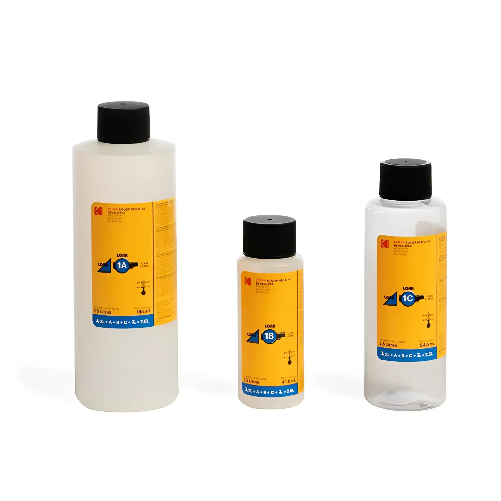 Three transparent plastic bottles with black caps and bright yellow labels, each containing a clear liquid.