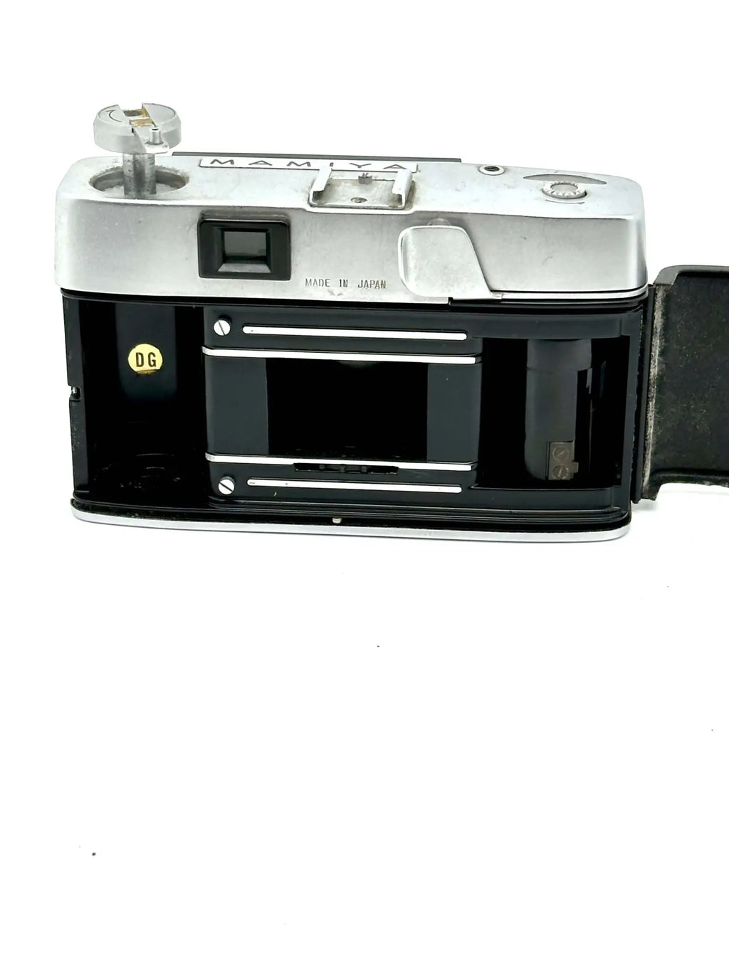 Silver and black mamiya film camera with a classic rangefinder design.