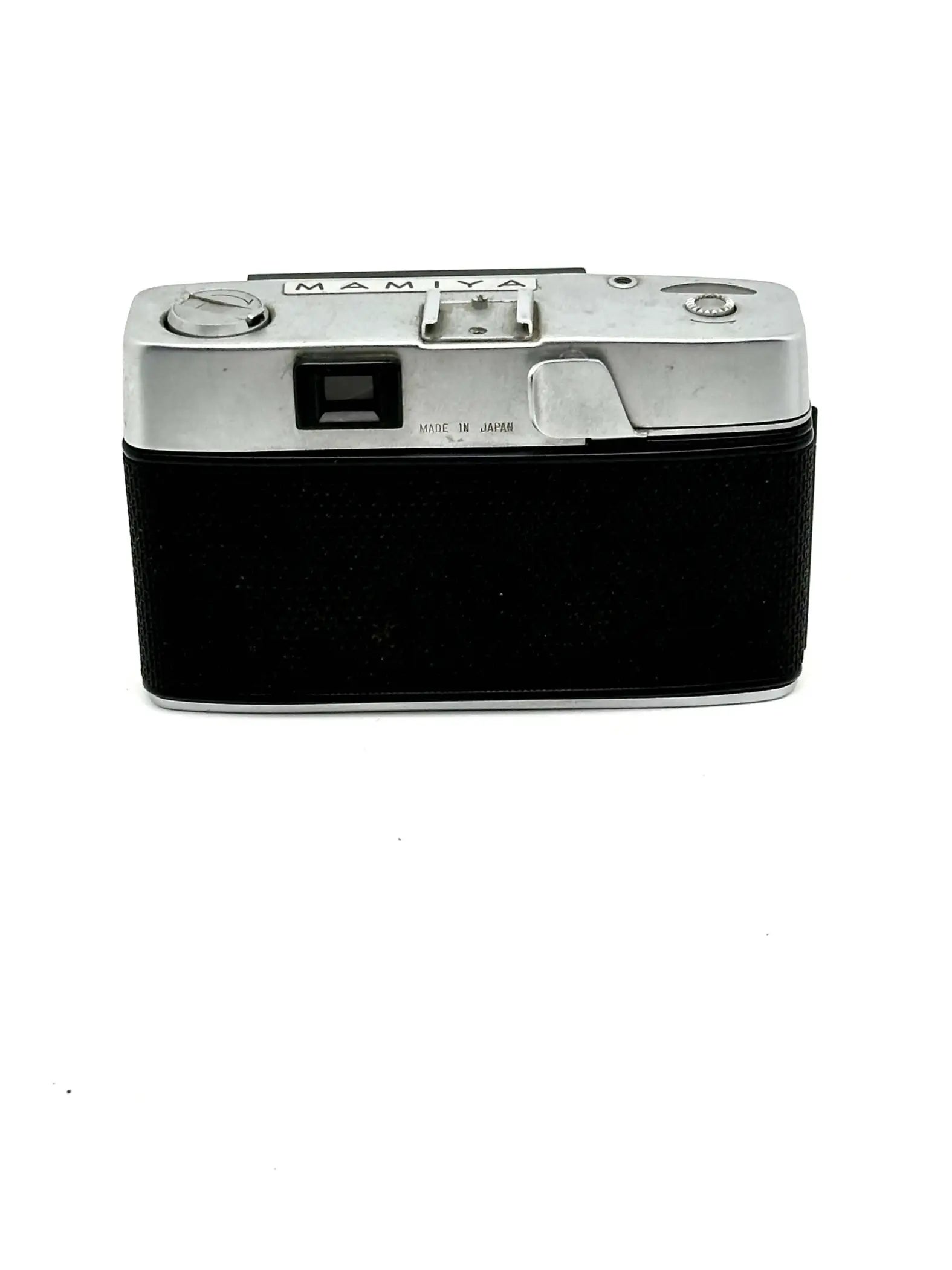 Silver-bodied mamiya film camera with a black textured leather grip.