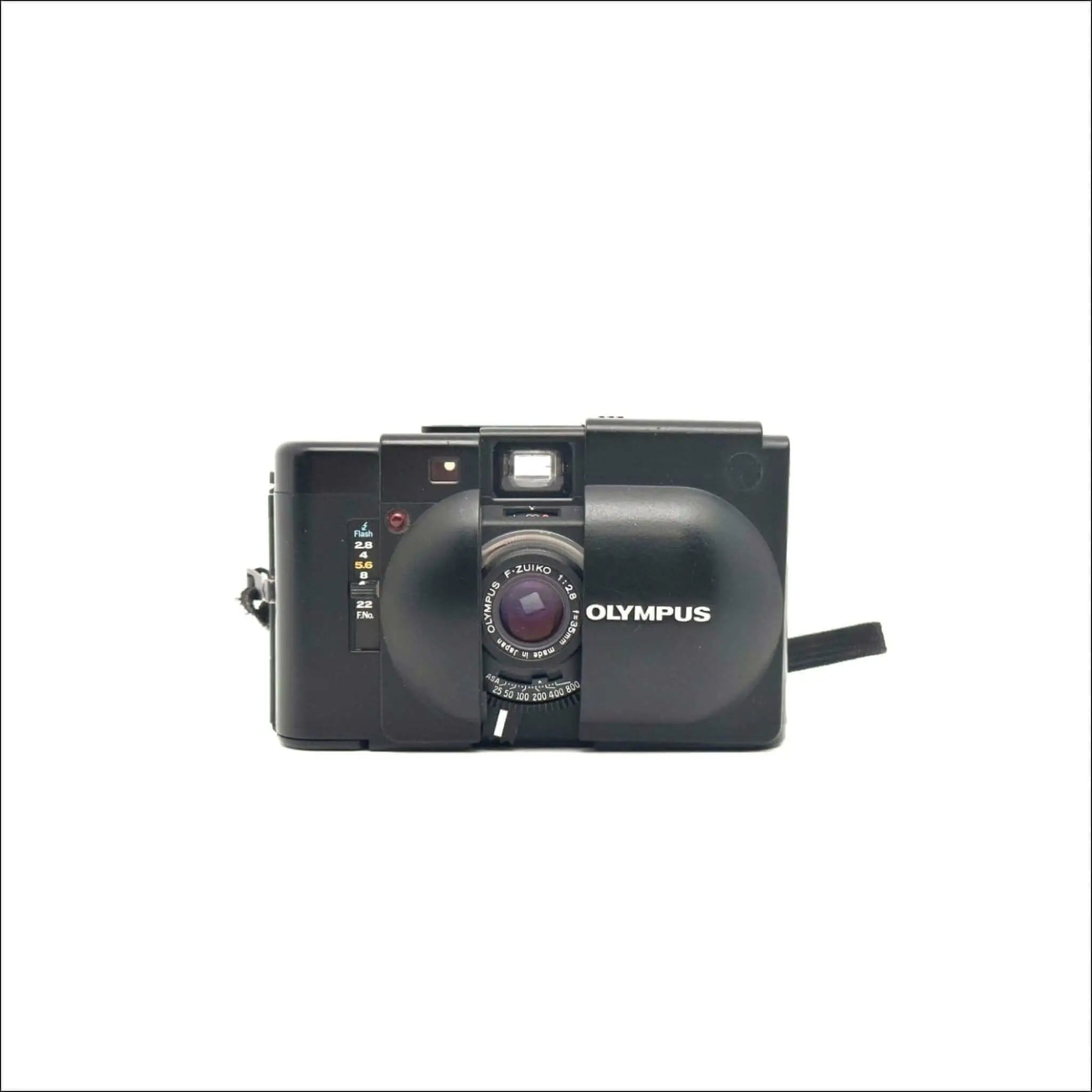 Black olympus camera with a prominent lens and flash.