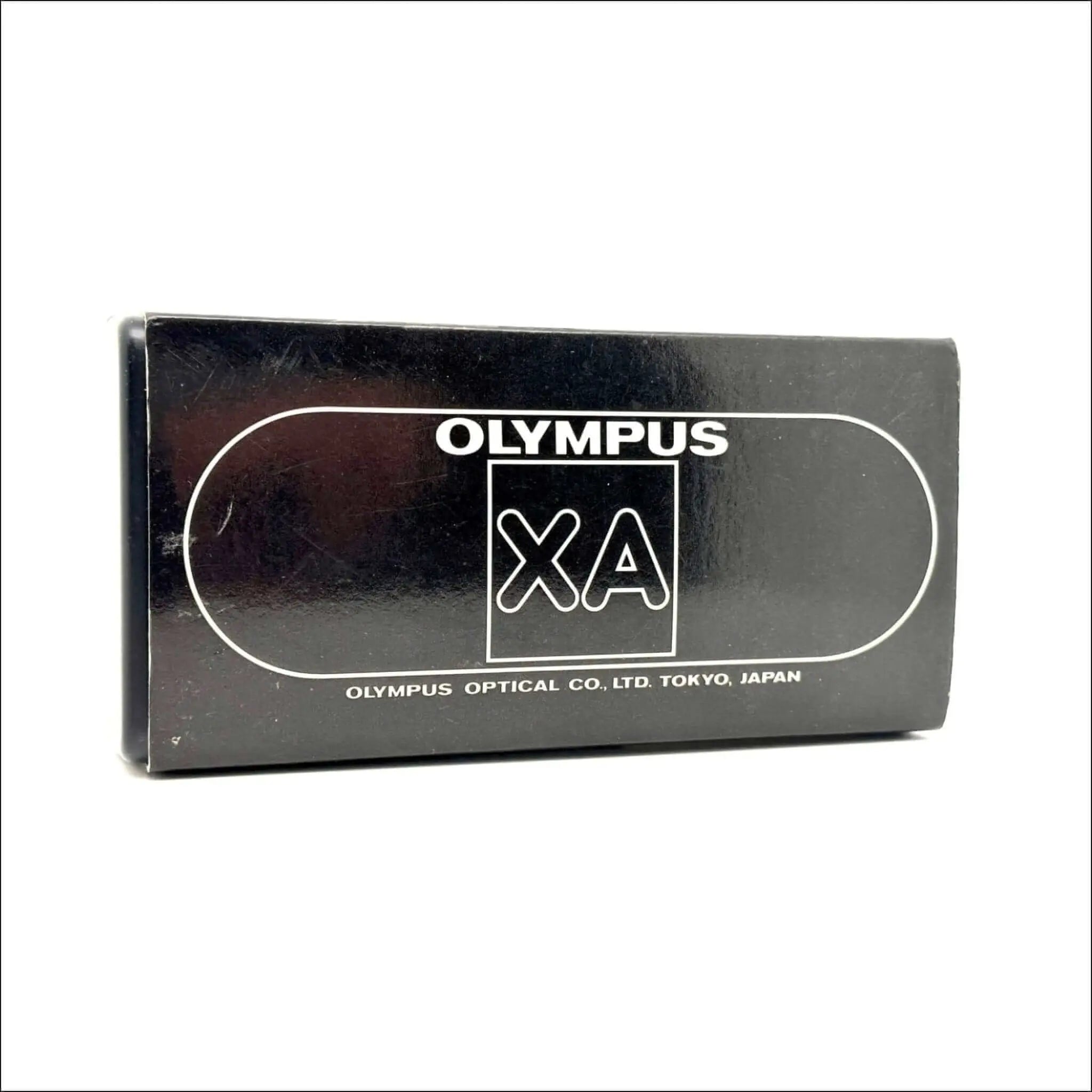 Black rectangular box for an olympus xa camera, featuring white branding and text.